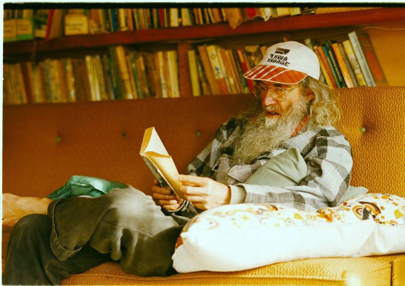 The 2004 photo of me reading to two others, in the furnished end of our barn in the Kauaeranga Valley, New Zealand