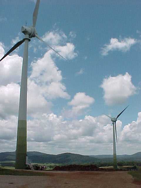New Zealand skyscape with two large windturbines at Trustpower's Tararua Windfarm